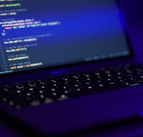 black laptop computer turned on displaying blue screen