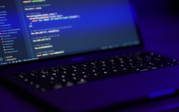 black laptop computer turned on displaying blue screen